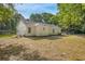 Spacious, fenced backyard, providing a secure and private outdoor area with a view of the home's exterior at 1834 Stroud Road, Mcdonough, GA 30252