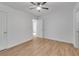 A minimalist bedroom offers natural light, modern floors, and white painted walls at 1834 Stroud Road, Mcdonough, GA 30252