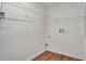 A laundry room features wire shelving, wooden floors, and a white painted interior at 1834 Stroud Road, Mcdonough, GA 30252