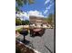 Outdoor dining area with a large table, grill, and view of the townhomes in the community at 2197 Wexford Dr # 39, Atlanta, GA 30319