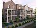 Modern townhome exterior featuring brick facade, private balconies, and professionally landscaped front yard at 2197 Wexford Dr # 39, Atlanta, GA 30319