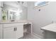 Bathroom featuring a large mirror and white cabinets at 301 Retreat Way, Carrollton, GA 30116