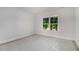 Bright bedroom featuring a large window offering a view of lush greenery at 301 Retreat Way, Carrollton, GA 30116