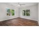 Bright bedroom with two large windows and hardwood floors offering tree-lined views at 301 Retreat Way, Carrollton, GA 30116