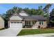 Charming home features a well-manicured lawn, a two-car garage, and a welcoming front entrance at 301 Retreat Way, Carrollton, GA 30116
