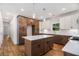 Modern kitchen featuring a central island, white subway tile backsplash, stainless appliances, and a view to the yard at 301 Retreat Way, Carrollton, GA 30116