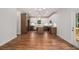 Spacious kitchen features a center island, stainless steel appliances, white cabinets, and a modern chandelier at 301 Retreat Way, Carrollton, GA 30116