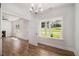Bright and airy living room features hardwood floors, a modern ceiling fan, and natural lighting at 301 Retreat Way, Carrollton, GA 30116