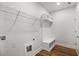 Mud room features wooden floors with a built-in bench and overhead shelving at 301 Retreat Way, Carrollton, GA 30116