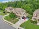 Charming two-story home with a brick facade, two-car garage, and a luscious manicured lawn at 6415 Yellow Birch St, Cumming, GA 30040