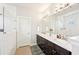 Stylish bathroom featuring a double vanity, luxurious countertops, and sleek fixtures at 6415 Yellow Birch St, Cumming, GA 30040