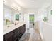 Bright and modern bathroom with double sink vanity, tiled shower, and plenty of counter space at 6415 Yellow Birch St, Cumming, GA 30040