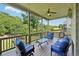 Inviting screened-in deck perfect for relaxation and outdoor dining overlooking the trees at 6415 Yellow Birch St, Cumming, GA 30040