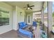 Charming screened-in deck complete with comfortable seating, and views to the landscaped backyard at 6415 Yellow Birch St, Cumming, GA 30040
