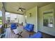 Relaxing screened-in deck with cozy seating area and views of the private backyard and trees at 6415 Yellow Birch St, Cumming, GA 30040