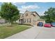 Lovely home shows a three-car garage, long driveway, and well-kept lawn at 6415 Yellow Birch St, Cumming, GA 30040