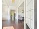 Inviting foyer features hardwood floors, white trim, and an open view to the living room at 6415 Yellow Birch St, Cumming, GA 30040