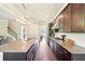 Spacious kitchen with a large island, granite countertops, and stainless steel appliances at 6415 Yellow Birch St, Cumming, GA 30040