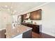 Kitchen island featuring granite countertops, ample cabinet space, and stainless steel appliances at 6415 Yellow Birch St, Cumming, GA 30040