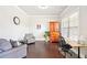 Comfortable living room with hardwood floors, neutral paint, and a cozy seating area at 6415 Yellow Birch St, Cumming, GA 30040