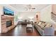 Spacious living room with hardwood floors and stone fireplace at 6415 Yellow Birch St, Cumming, GA 30040