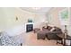 Cozy living room with a fireplace, plush seating, and soft carpet at 6415 Yellow Birch St, Cumming, GA 30040