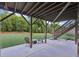 Spacious lower patio offering concrete flooring and stairs to the upper deck, perfect for outdoor relaxation at 6415 Yellow Birch St, Cumming, GA 30040