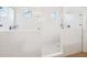 Contemporary bathroom with a spacious tiled shower featuring glass doors and modern fixtures at 6415 Yellow Birch St, Cumming, GA 30040