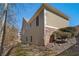 Well-maintained exterior featuring stone accents, professional landscaping, and a private backyard at 216 Crescent Moon Way, Canton, GA 30114