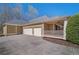 Spacious garage with a wide driveway and an adjacent covered porch for outdoor relaxation at 216 Crescent Moon Way, Canton, GA 30114