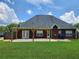 A well-maintained lawn and a cozy pergola-covered patio enhance outdoor living in this backyard at 337 Inverness Ave, Mcdonough, GA 30253