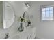 Bathroom features double sinks, framed mirrors, and tiled floors at 337 Inverness Ave, Mcdonough, GA 30253