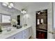 Bright primary bath with double vanity, shower, tub and bedroom doorway at 337 Inverness Ave, Mcdonough, GA 30253