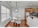 Bright breakfast nook with white table and chairs, plus a window for ample natural light at 337 Inverness Ave, Mcdonough, GA 30253