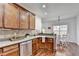 Bright kitchen with stainless steel appliances, wood cabinets and dining area at 337 Inverness Ave, Mcdonough, GA 30253