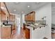 Traditional kitchen with wood cabinets, breakfast bar and granite countertops at 337 Inverness Ave, Mcdonough, GA 30253