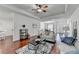 This bright living room features hardwood floors, recessed lighting and modern ceiling fan at 337 Inverness Ave, Mcdonough, GA 30253