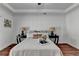 Bright bedroom offers comfortable bedding, hardwood floors, ceiling fan and recessed lighting at 337 Inverness Ave, Mcdonough, GA 30253
