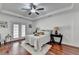 The main bedroom features hardwood floors, a ceiling fan, and a glass door at 337 Inverness Ave, Mcdonough, GA 30253