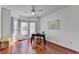 Well-lit office with wood floors, bright windows, curtains, ceiling fan, and desk at 337 Inverness Ave, Mcdonough, GA 30253