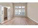Bright bedroom with large windows and a walk-in closet at 971 Reap Ln, Lawrenceville, GA 30043