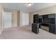Bedroom with a large desk, shelving, closet and neutral carpeting at 971 Reap Ln, Lawrenceville, GA 30043