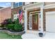 Elegant front entrance with stone accents, a stylish door, and mature landscaping at 971 Reap Ln, Lawrenceville, GA 30043