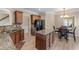 Spacious kitchen with an island, wood cabinets, granite countertops, and open to eating area at 971 Reap Ln, Lawrenceville, GA 30043
