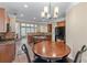 Open-concept kitchen with wood cabinets, granite countertops, and stainless steel appliances at 971 Reap Ln, Lawrenceville, GA 30043