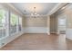 Bright living room featuring large windows, wood floors, and neutral paint at 971 Reap Ln, Lawrenceville, GA 30043