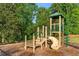 Community playground with slide, climbing bars, and lookout tower surrounded by tall trees at 971 Reap Ln, Lawrenceville, GA 30043