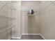 A walk-in closet that has neutral walls and carpet with wire shelving, providing storage solutions at 971 Reap Ln, Lawrenceville, GA 30043
