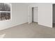 Sunny bedroom with closet and a window, enhanced by neutral carpet at 2717 Montie Ct, Lithia Springs, GA 30122