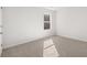 Carpeted bedroom with large window allowing in sunlight and fresh air at 2717 Montie Ct, Lithia Springs, GA 30122
